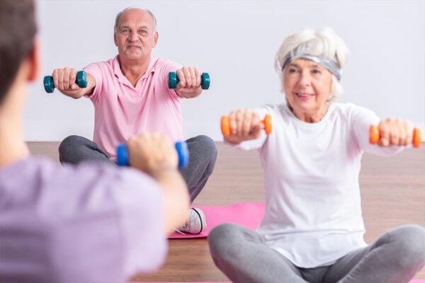 Active Senior retirement community residents participating in an exercise class