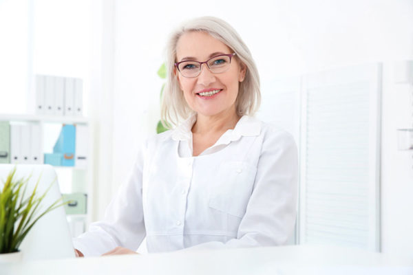 Adult woman working as a receptionist.