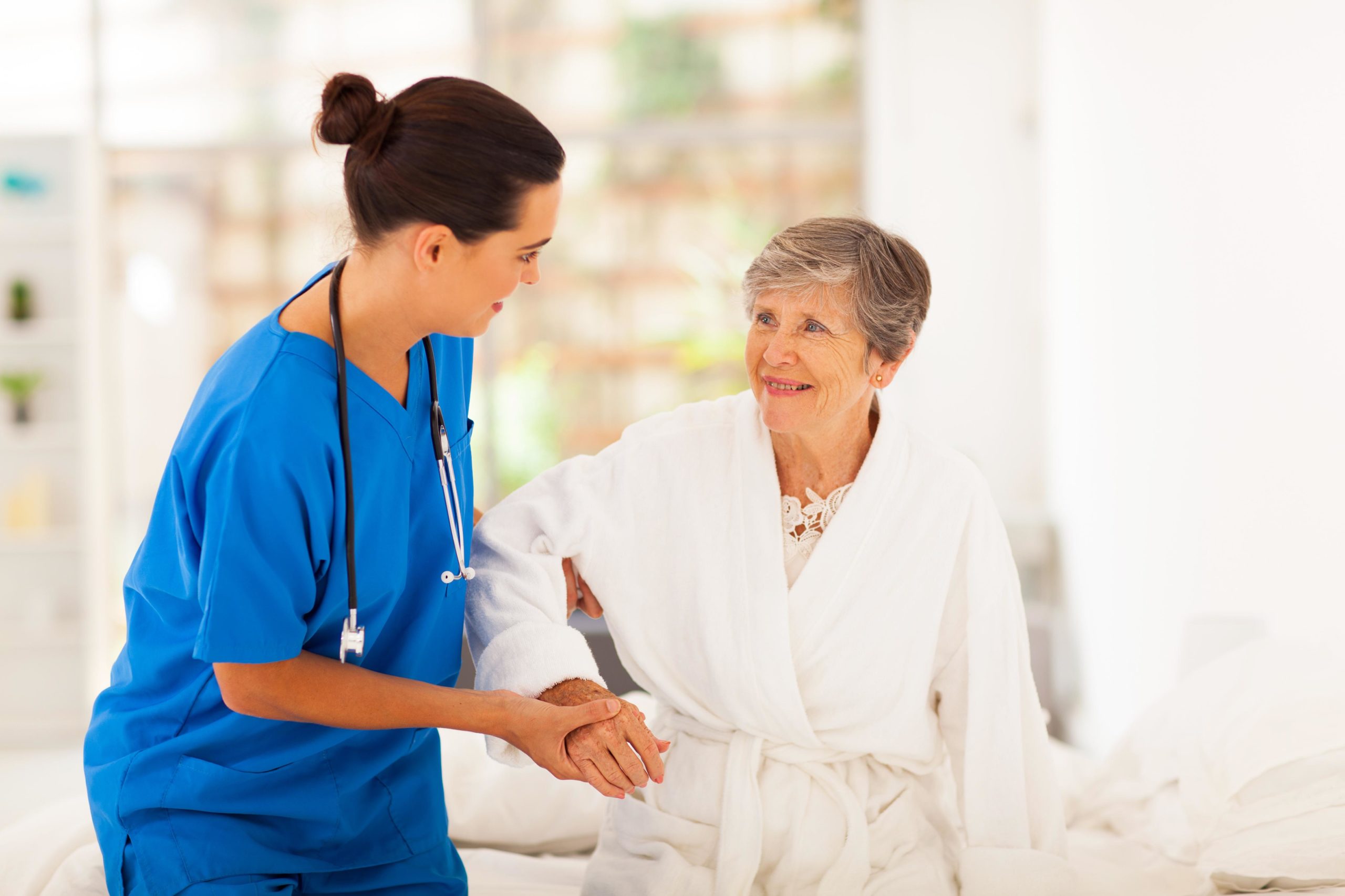 https://www.riddlevillage.com/wp-content/uploads/Care-giver-assisting-senior-woman-with-her-hygiene.-scaled.jpg