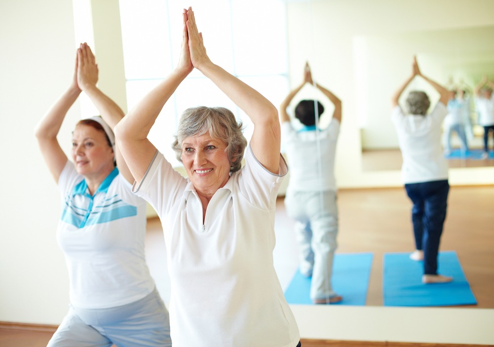 Do yoga at Riddle Village nursing home Seniors learning yoga