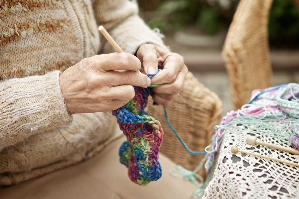 Riddle Village learn to knit Senior learning to knit in retirement