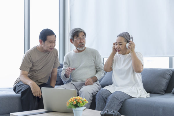 10 Amazing Artists And Bands From The ’50S 5 old men and women listening to music with laptop in the living room. senior friends group hangout, older people meeting.