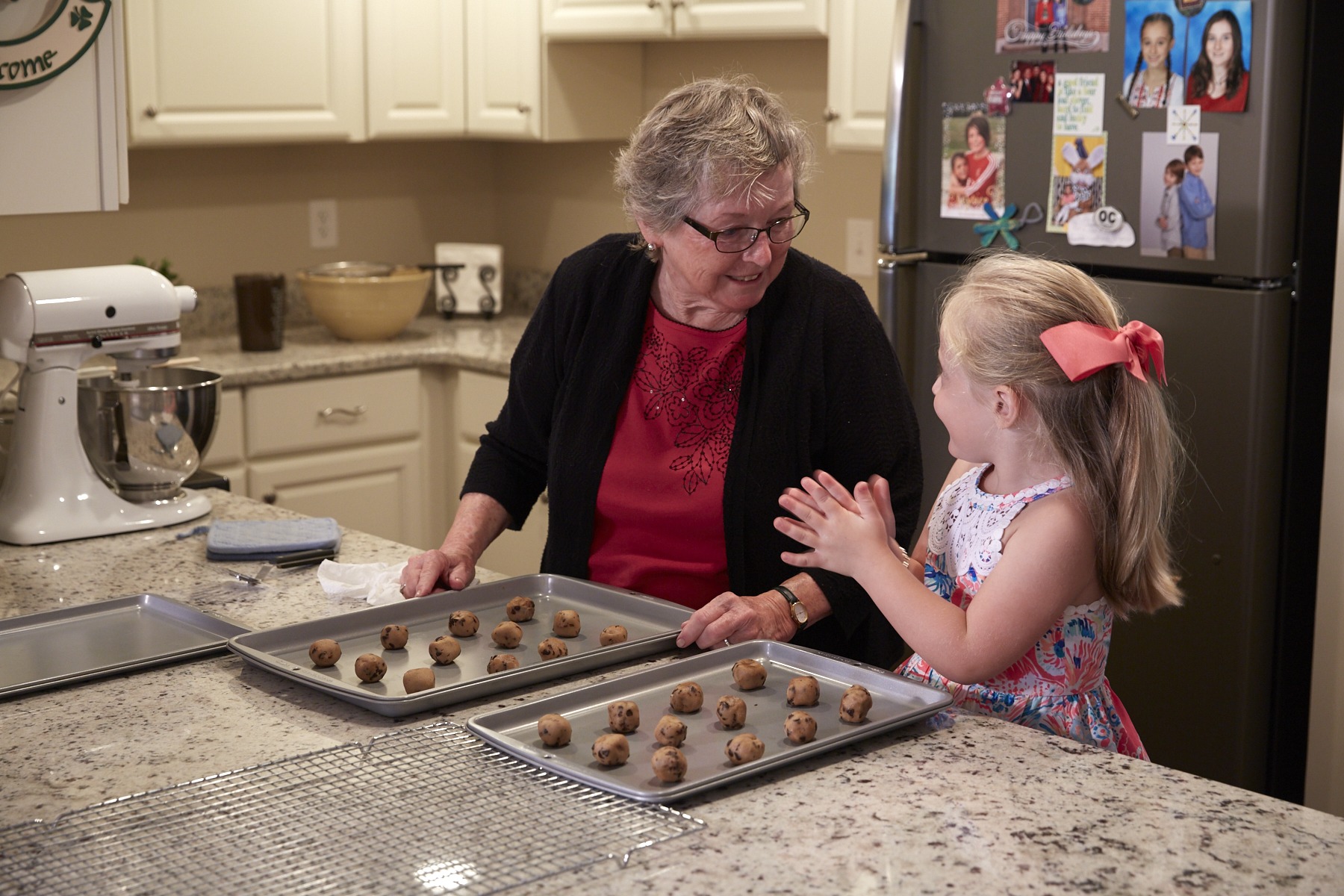 An elderly woman and her granddaughter baking at our continuing care retirement community in Pennsylvania