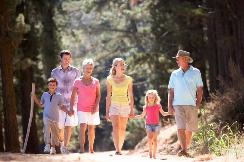 Senior couple enjoying a good walk with their family. Senior couple enjoying a good walk with their family.