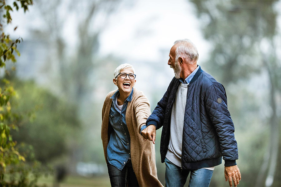 Senior couple happy walking together and has peace of mind due to advance care planning. Senior couple happy walking together and has peace of mind due to advance care planning.