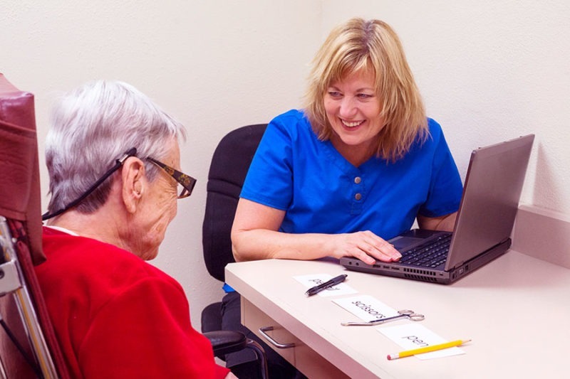 senior lady undergoing visual speech perception therapy.