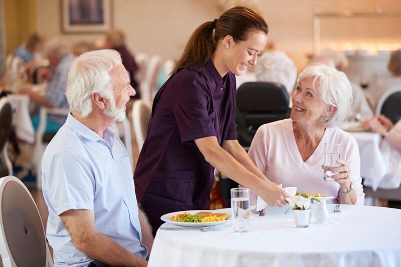 Seniors enjoying a balanced nutritional meal that supports healthy aging