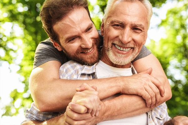 Son hugging his father