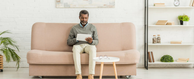 Multipurpose Furniture Ideas For Studio Apartments 9 african american man holding tablet and sitting down