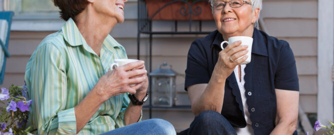 How Much Does A Life Plan Community Cost In Pennsylvania? 1 two older women enjoying coffee together on a porch, featured in life plan community cost information.
