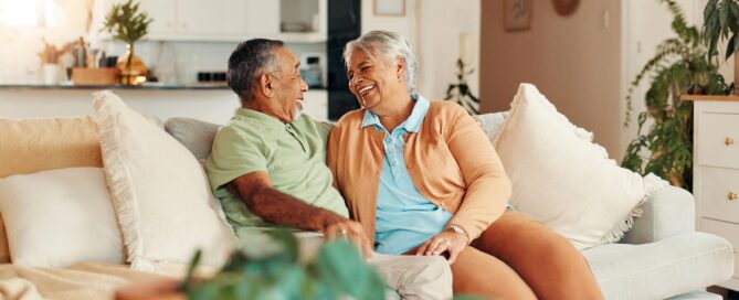 Retirement Planning For Couples: When One Spouse Is Ready For Change And The Other Is Not 1 older married couple discussing retirement plans together at home. - retirement planning for couples featured image