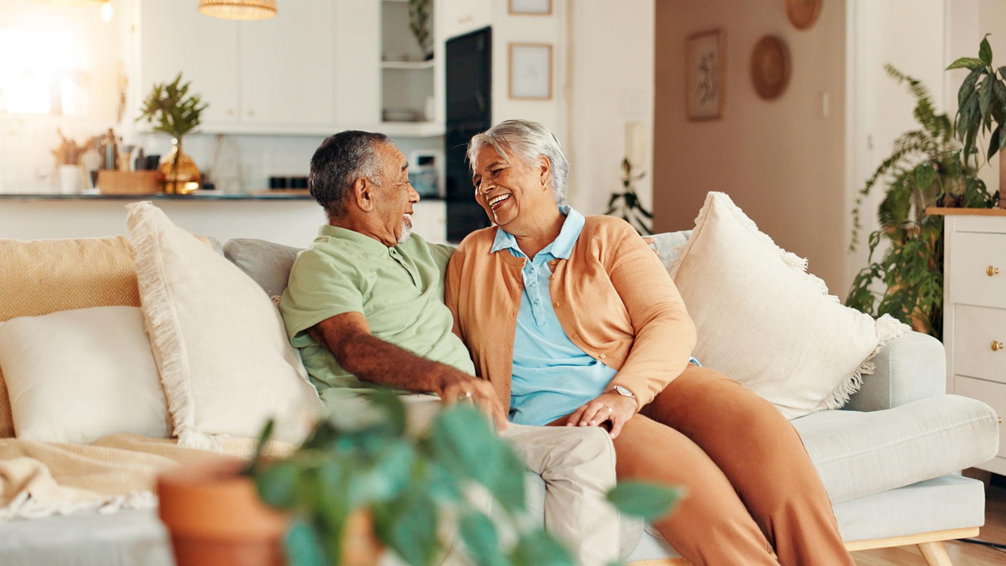 Retirement Planning For Couples: When One Spouse Is Ready For Change And The Other Is Not 1 older married couple discussing retirement plans together at home. - retirement planning for couples featured image