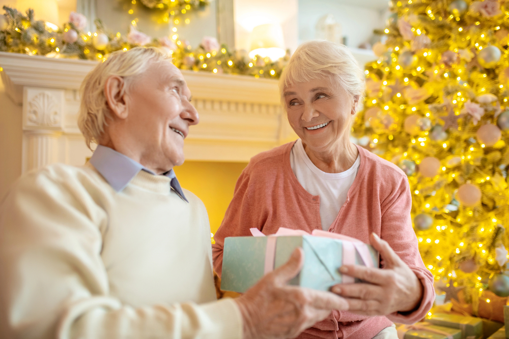 seniors enjoying holiday activities together, representing warm and joyful senior holiday activities