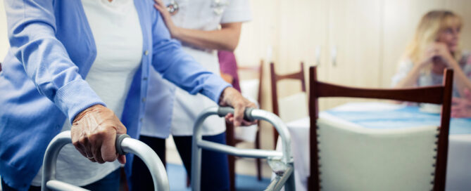 What Happens After A Hospital Stay? Short-Term Rehab At Riddle Village Explained 1 nurse assisting senior using walker during her short-term rehab at riddle village.