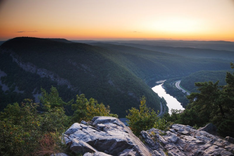 Sunset at mountain peak with river and mountain outlines from Delaware Water Gap, Pennsylvania.