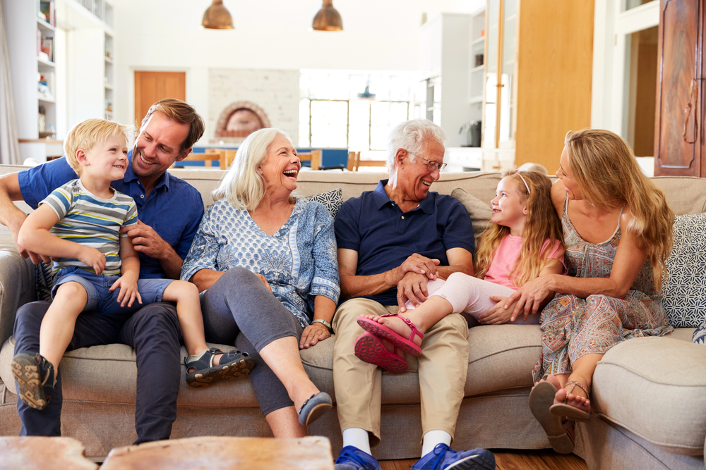 Visitor'S Guide: Making The Most Of Your Time At Riddle Village 1 grandparents enjoying a family visit in their bright living room, featured in our community visitors guide.