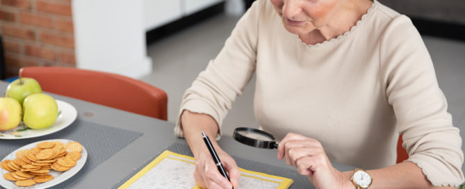 Mental Health Tips For Staying At Home 4 woman enjoys solving a crossword puzzle at home